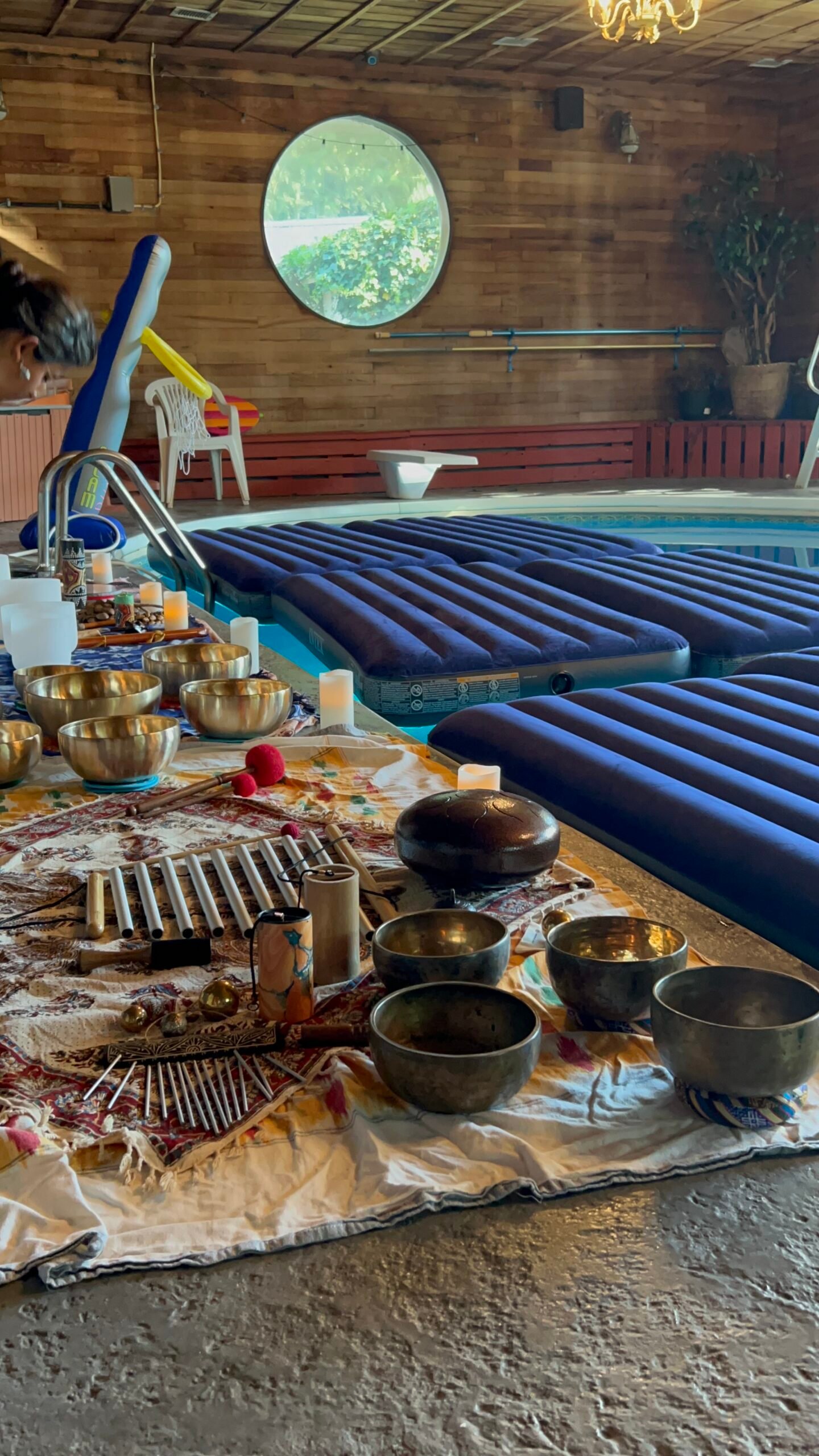Crystal sound bowls and Tibetan bowls arranged poolside